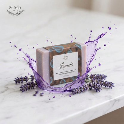 St. Mist Soap lavender bar with a splash of purple liquid and fresh lavender sprigs on a marble surface.
